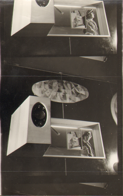 The exhibit reveals a view from Frederick Kiesler’s Art of This Century gallery, showcasing Frederick and Stefi Kiesler behind glass, with artworks including Robert Delaunay’s “Windows Open Simultaneously, 1st part, 3rd motif” (1912) above and Kurt Schwitters’s “Relief” (1923) on the glass.