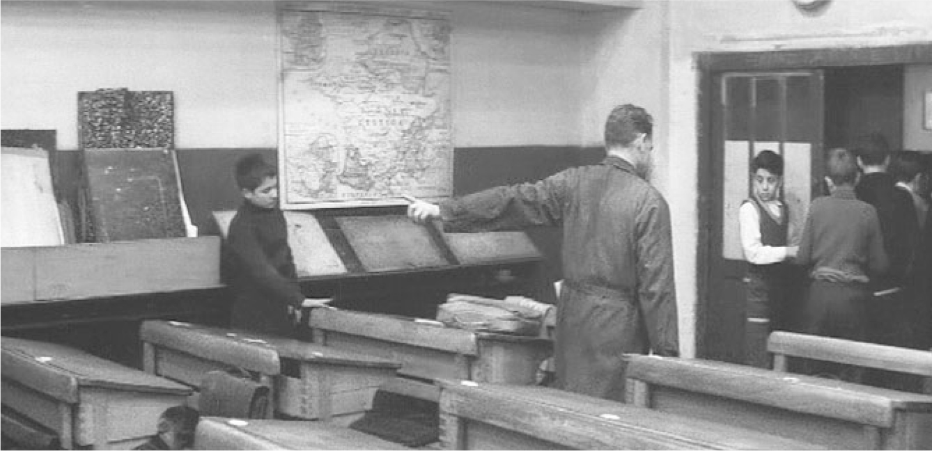 The exhibit shows a scene from “Les 400 coups” where the students are leaving the classroom while one stays behind.