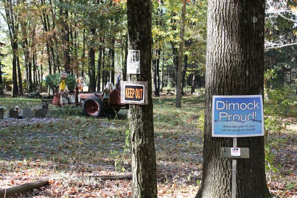 Signs stating, “Keep Out,” and “Dimock Proud,” and effigy of family-as-pigs set up to protest residents who complained about contaminated wellwater.