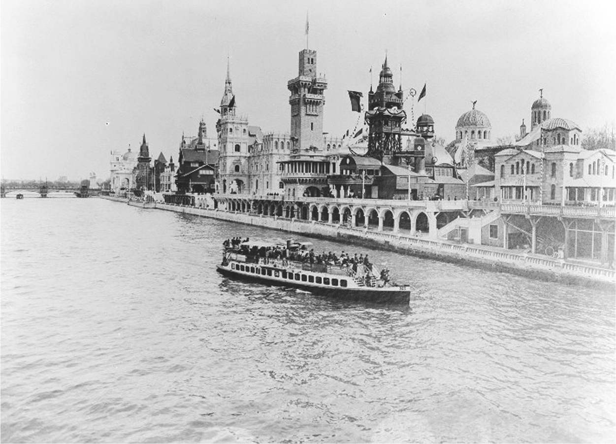 A photograph of a lake view of the International pavilions. A boat is sailing on the lake.