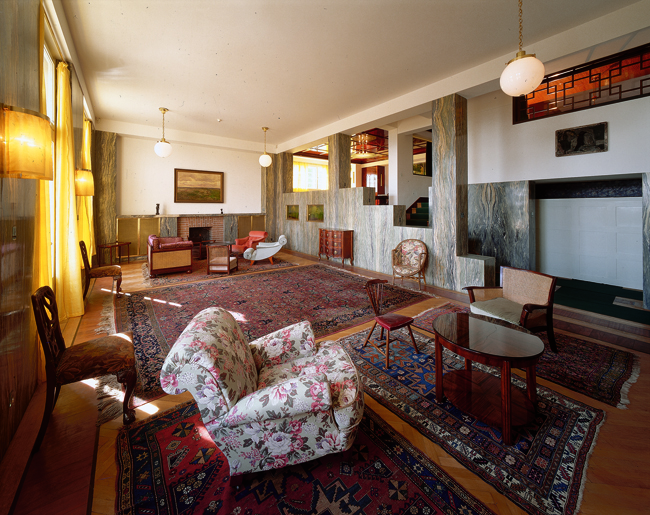 The exhibit displays Adolf Loos’s living room in Villa Müller, Prague.