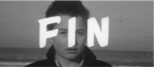 The exhibition highlights the final scene from “The 400 Blows,” displaying an individual with a backdrop of the sea. The frame has the word FIN written in capital letters.