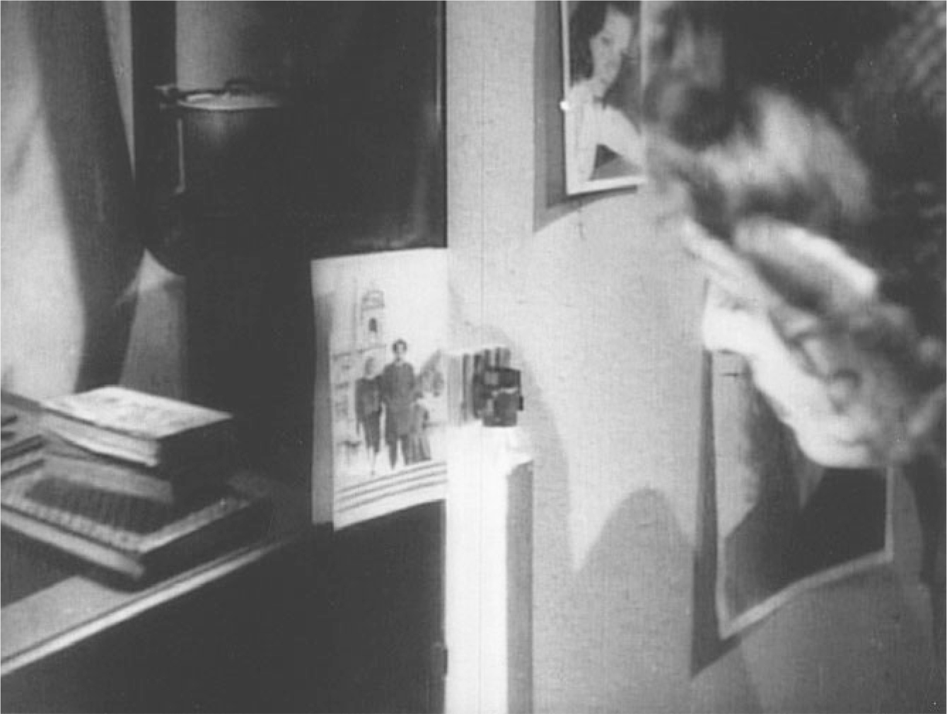 The exhibit depicts a scene from “Roma, città aperta” where Ingrid observes photographs.