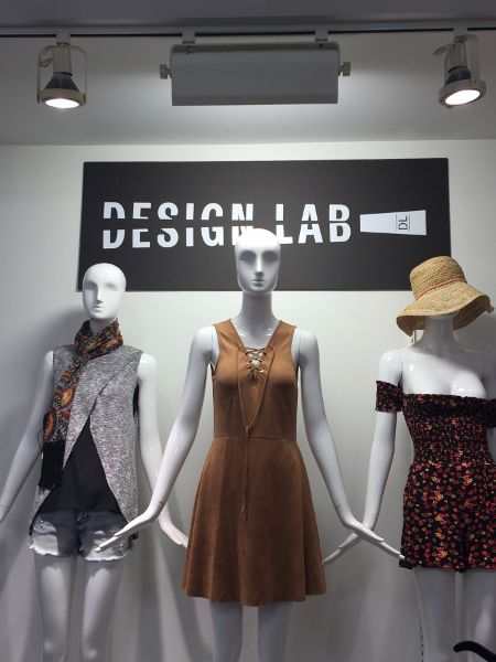 Three mannequins dressed in women’s summer fashions.