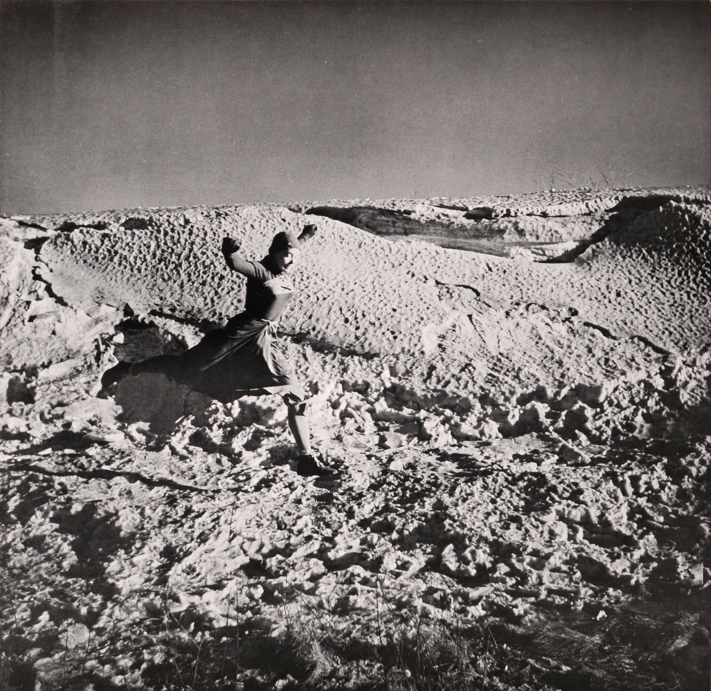 A woman running in a landscape.