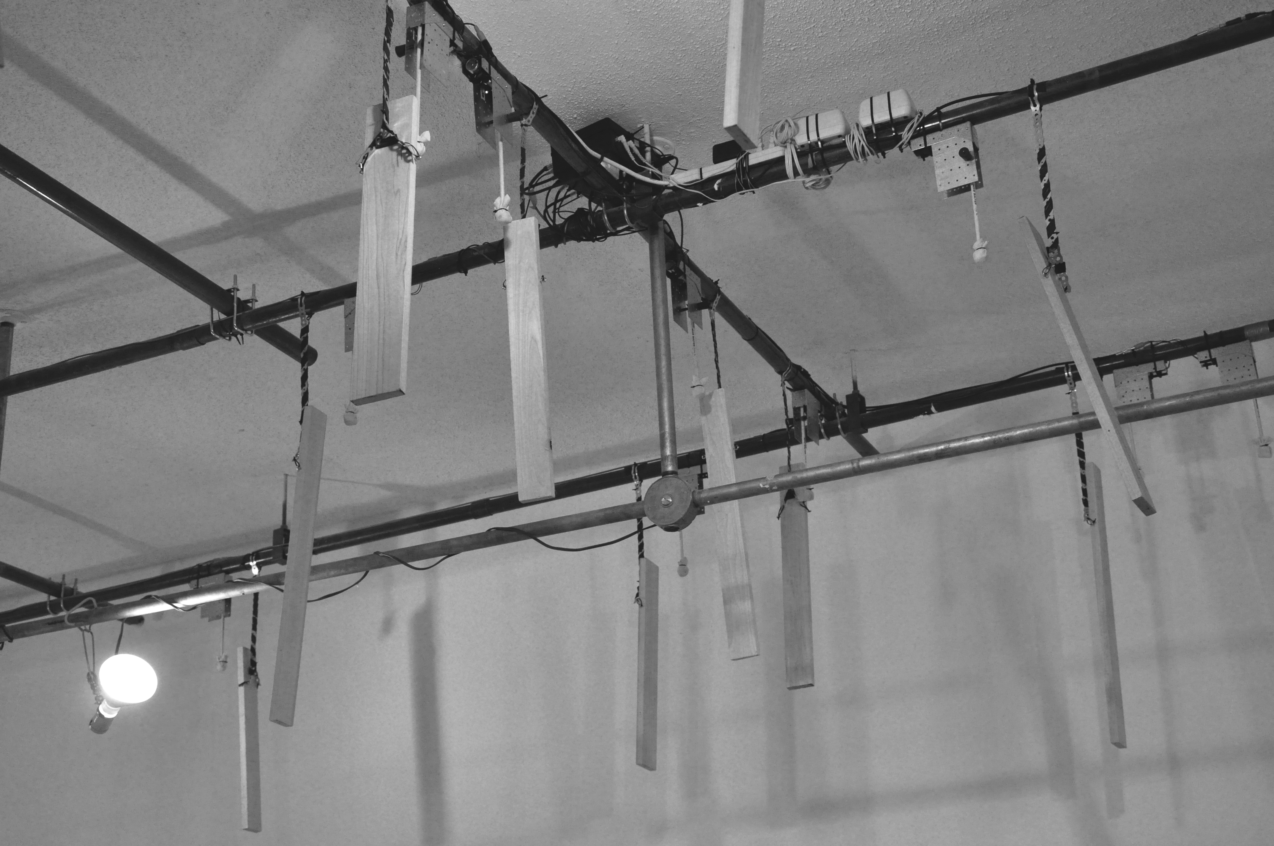 Installation detail of False Ruminations showing several of the mounted “Ludbots.”