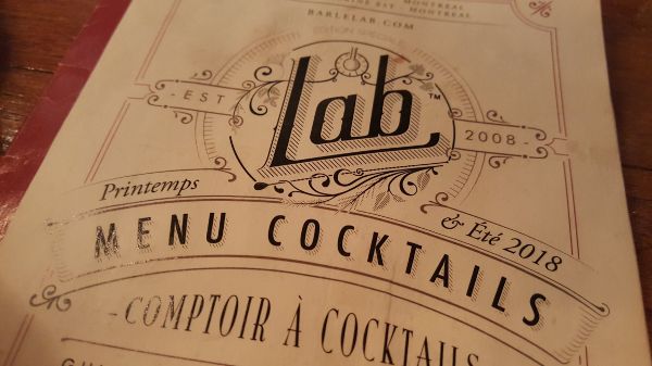 Menu cover employing stylized text evocative of eighteenth-century scientific writings.