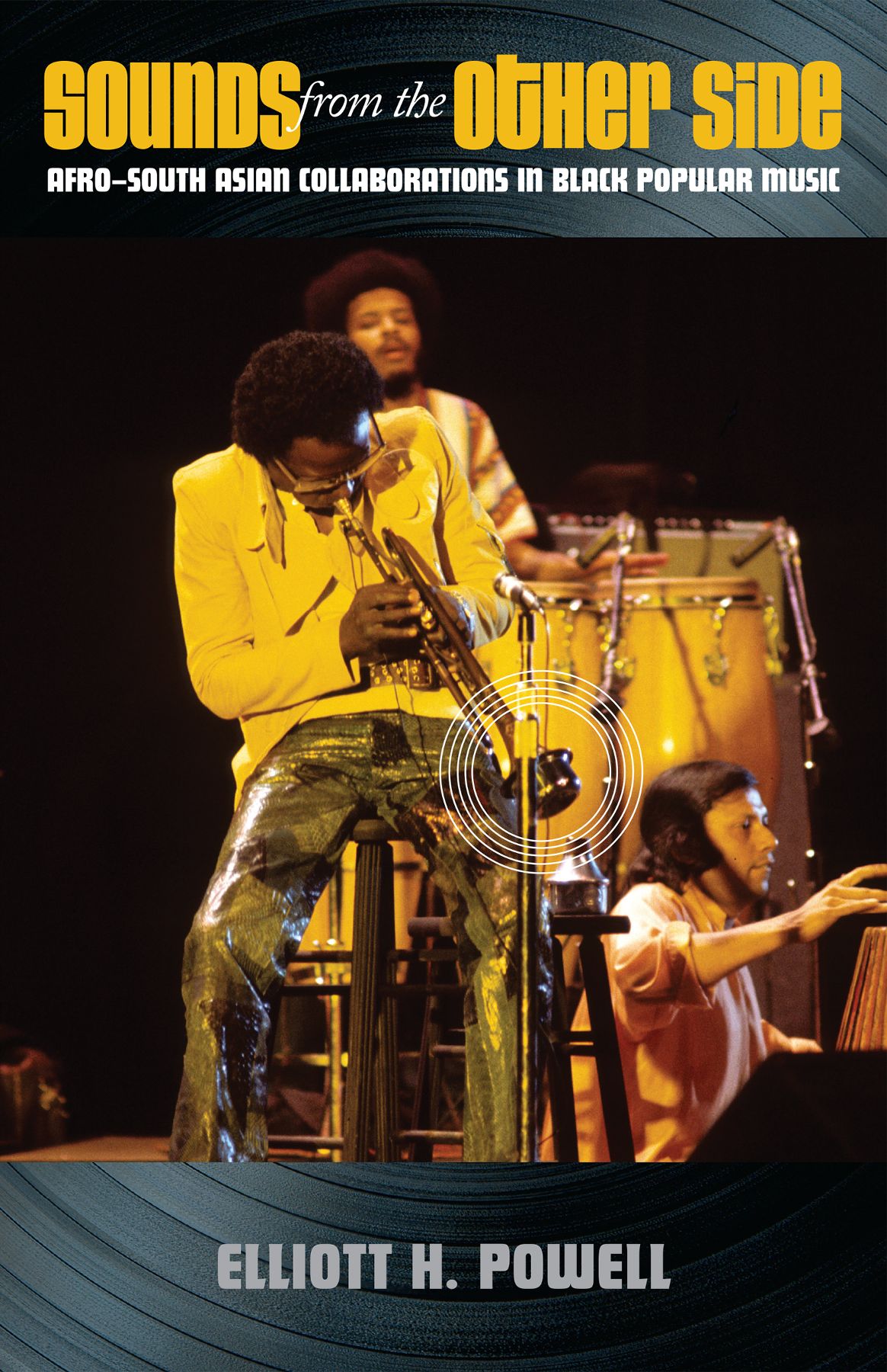 Cover image with yellow title text, prominently featuring a man playing the trumpet on stage.