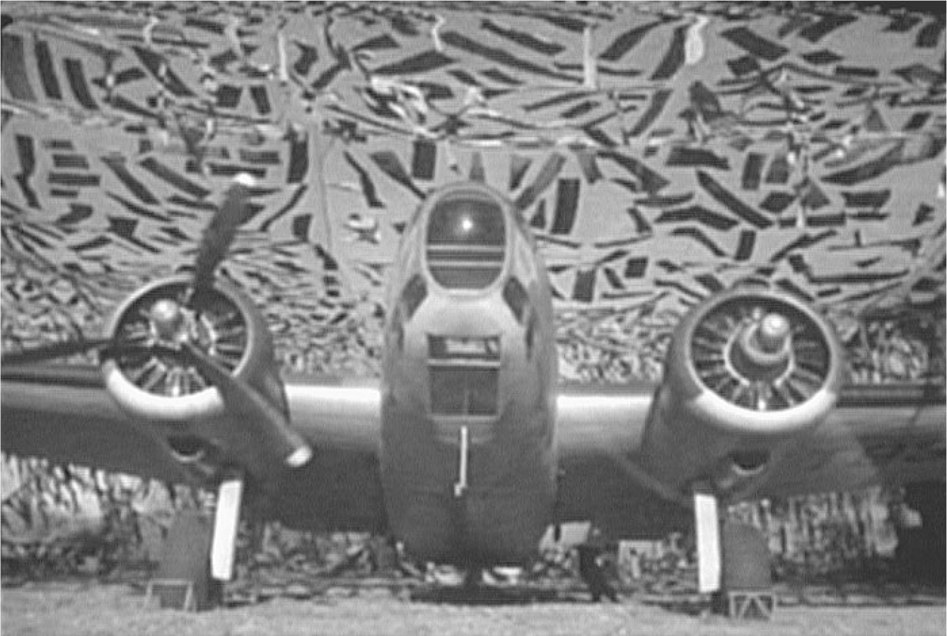 The exhibit presents a scene from the film “Desperate Journey” depicting an airplane about to take off, showcasing its front view.