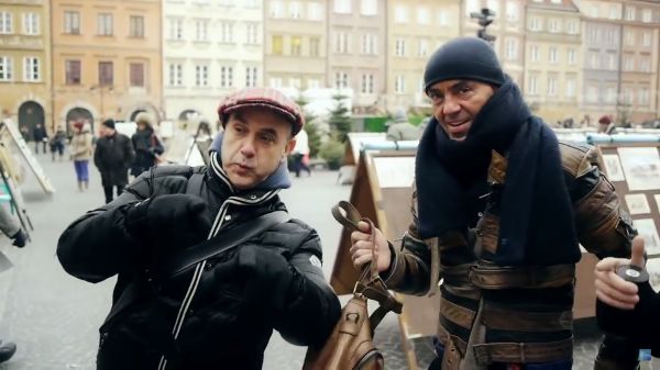 Image of two men wearking coats looking just past the camera