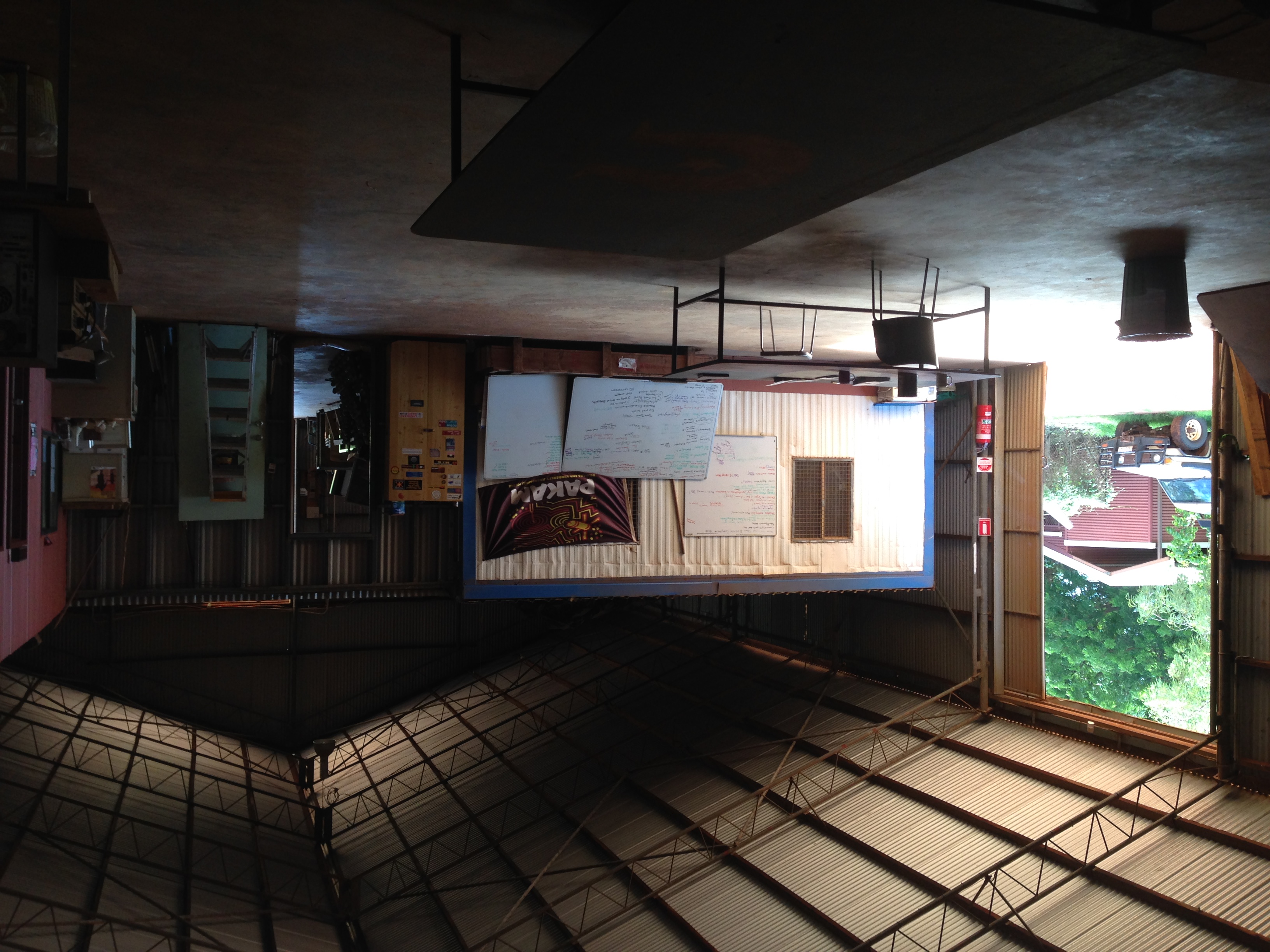 Taken from other side of the table as the previous image, showing the open shed door with a PAKAM troopy outside.