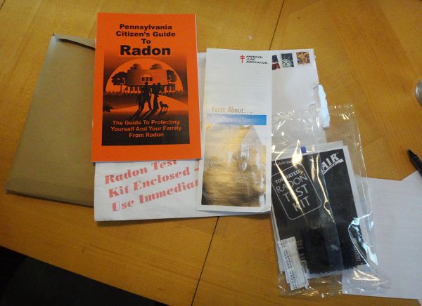 Participant showing brochure for monitoring radon.