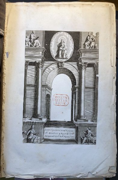 Archway bordered by columns; figures sit atop the columns and arch; two figures sit beneath the two columns.