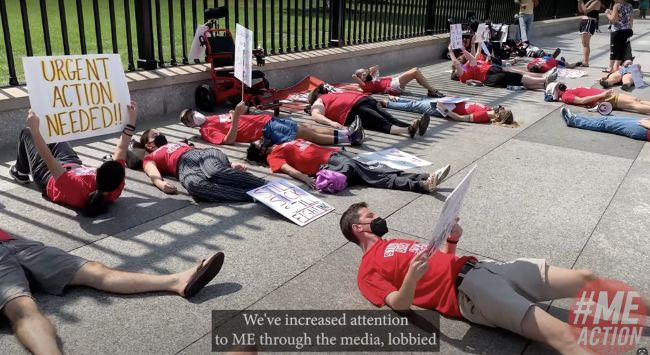 Protesters with ME/CFS lying in front of the White House with signs in September 2022.
