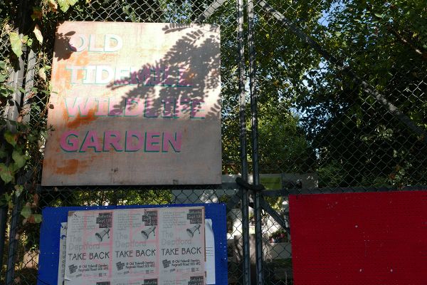 Old Tidemill Wildlife Garden entrance sign and event news for saving the garden.