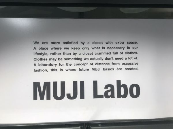Wall painted with writing and Muji Labo name.