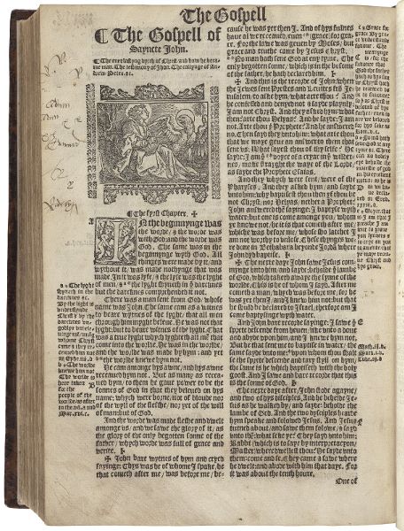 Printed page showing two columns of text; the first column displays a woodcut of a man and eagle, both with halos.