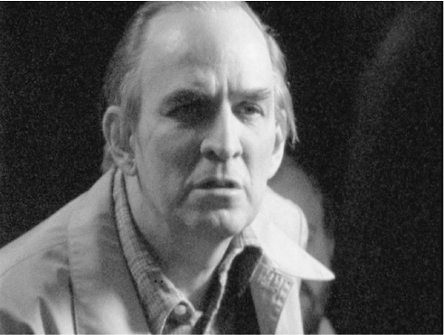 The exhibit features a shot of Ingmar Bergman in formal attire while directing the movie “Fanny and Alexander.”