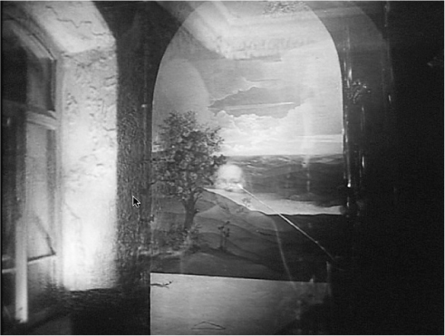 The exhibit showcases a still from the movie where a woman’s reflection in a mirror depicts an older version of herself.