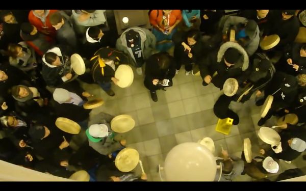 Photograph of a flash mob, viewed from directly above the center of the group