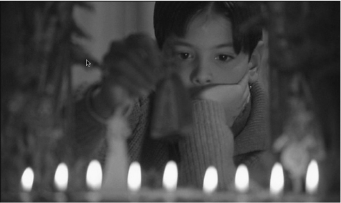 The exhibit portrays a scene from the opening of “Fanny and Alexander,” capturing a young boy playing with a miniature theatre set.