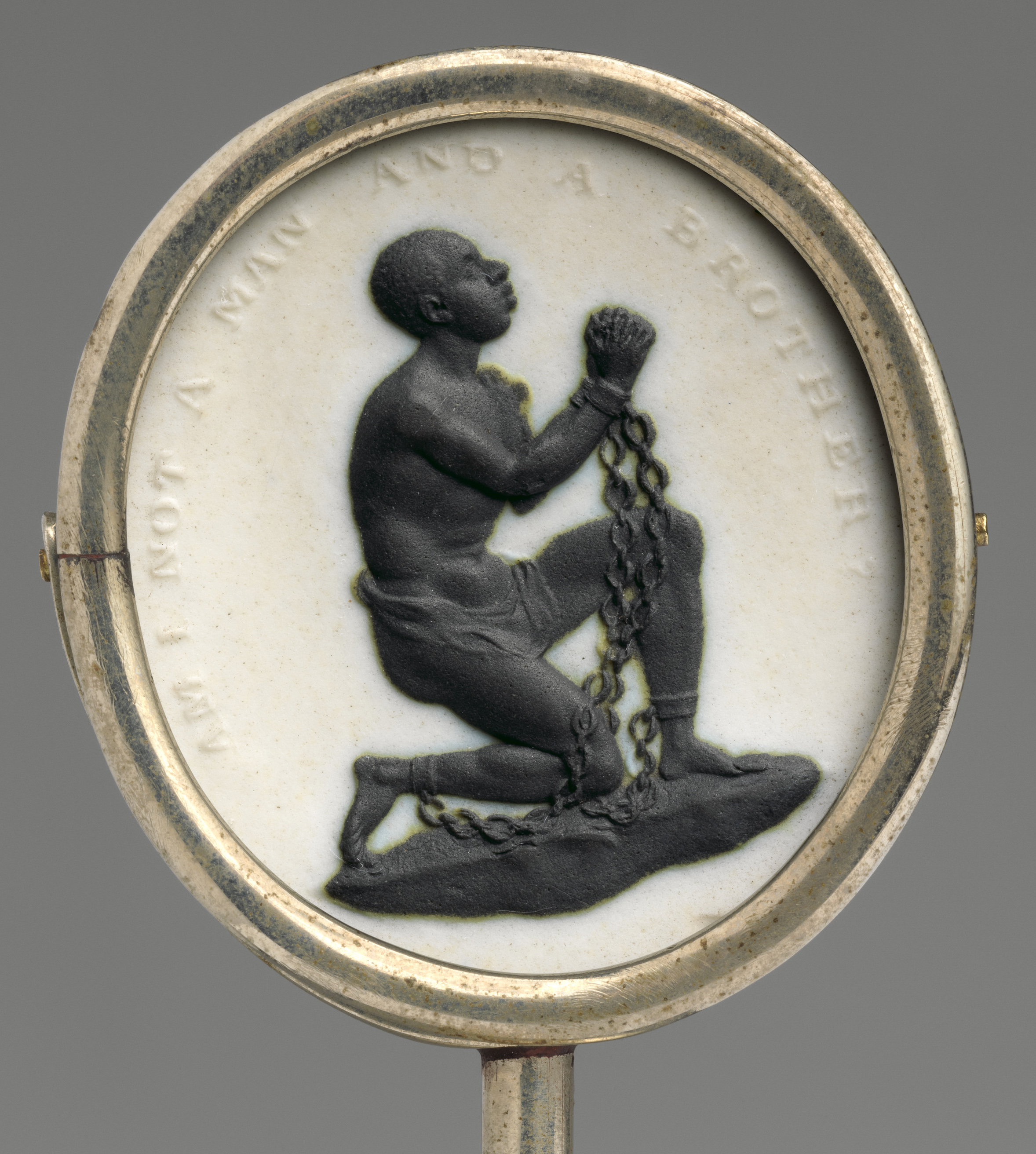 Circular cameo of an enslaved Black man, enchained and kneeling, with caption: �Am I not a man and a brother?�