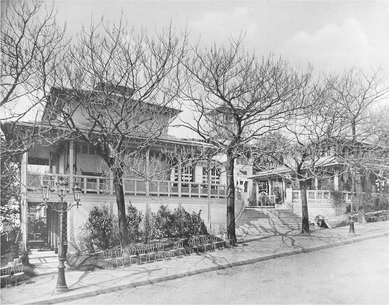 A photograph of Facade of the reunion pavilion with leafless trees.