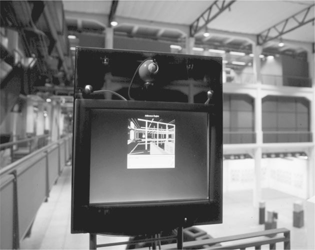 A photograph of a screen with the viewpoint of the environment captured seen on it.