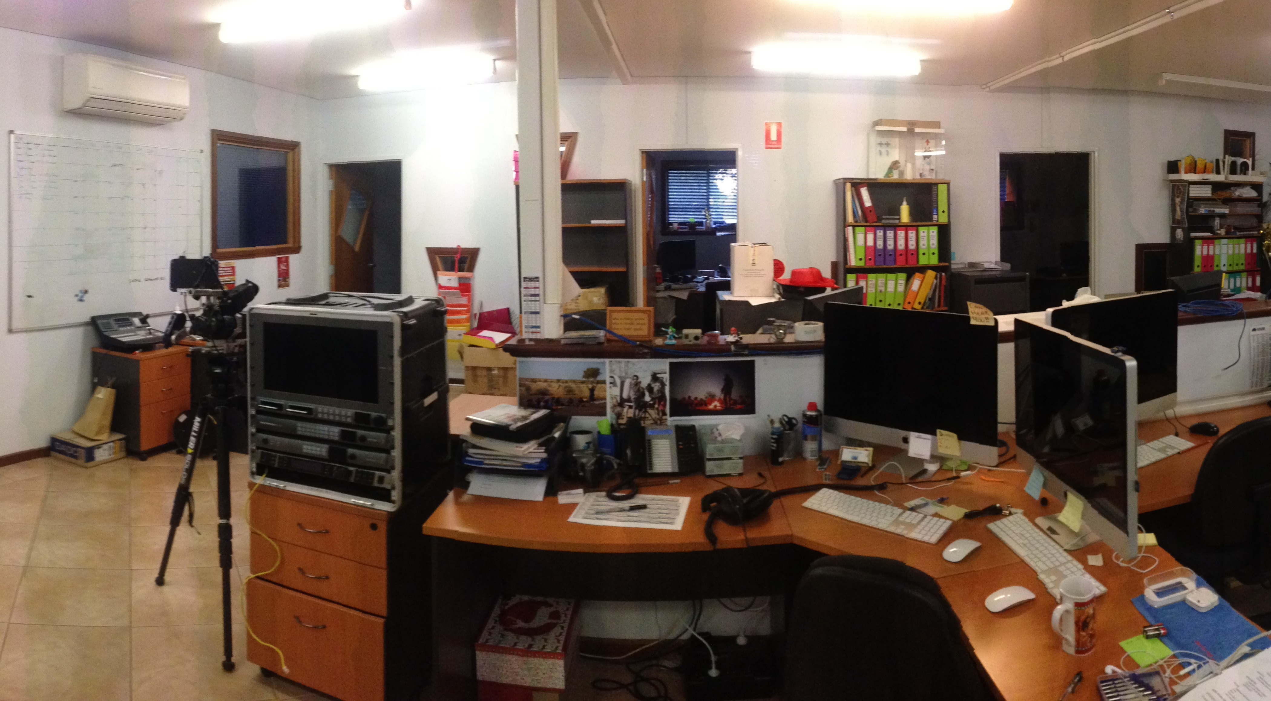 Goolarri’s open offices, including many desk areas, screens, and cameras.