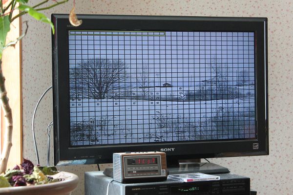 Television screen showing real-time CCTV footage from a camera that a resident has installed to document fracking activity near their property.