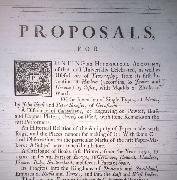 Printed page with the title “Proposals”; the first paragraph begins with a letterform of a P boxed with flora.