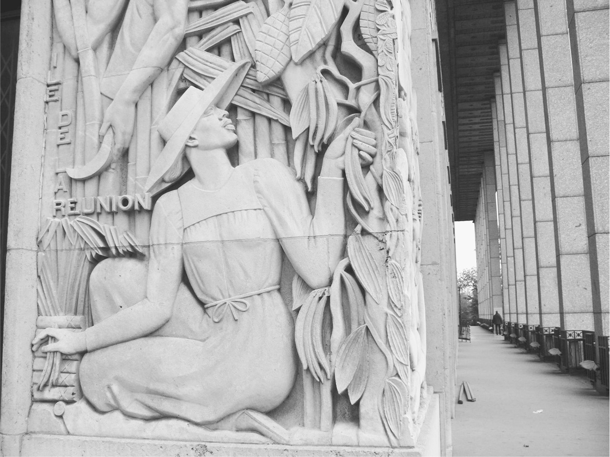 A photograph of bas-relief technique-based sculpture of a woman on the Musée des Colonies.