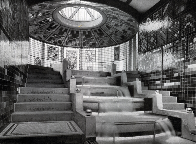 The display highlights Bruno Taut’s Glashaus, presenting a cascade and staircase adorned with an oculus.