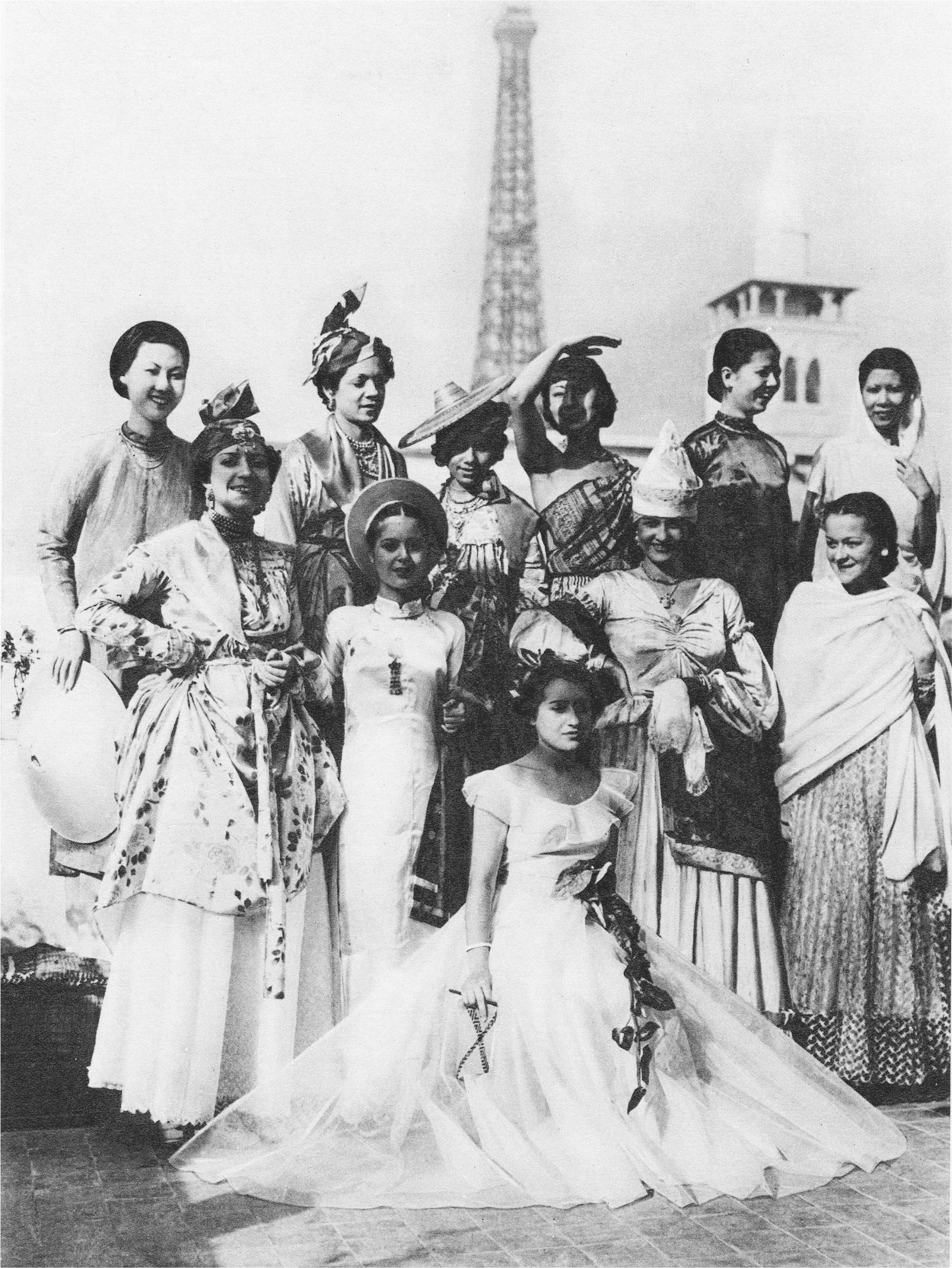A group photograph of eleven women dressed-up.