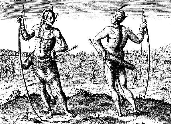 Two Native American men, one facing forward, the other toward the background stand side by side, each holding long bow in one hand and an arrow in the other.