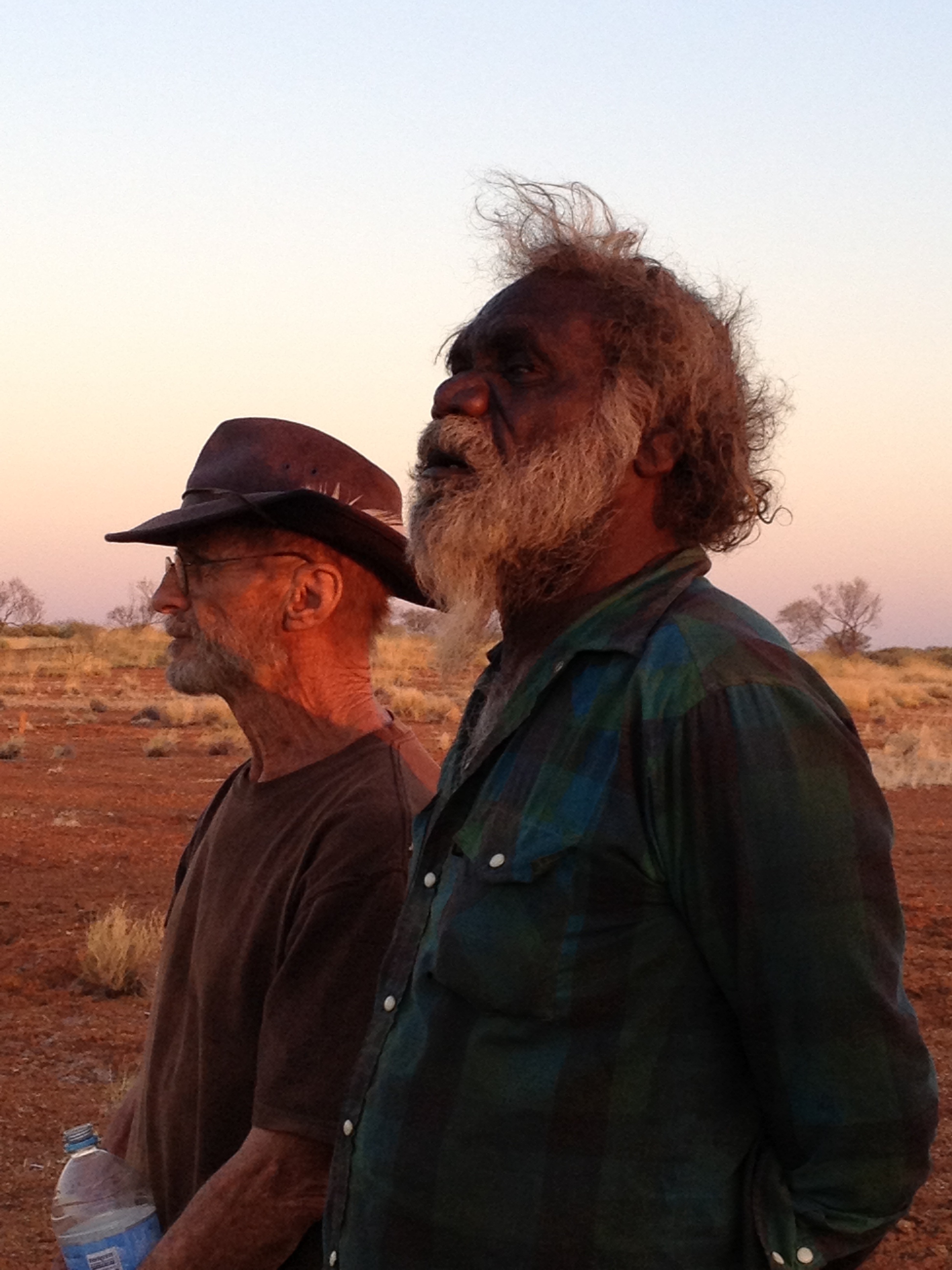 Side view of Mark and Warwick as the evening sun hits their faces.