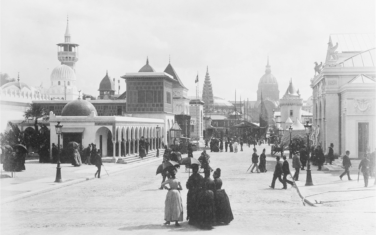 A photograph of Esplanade des Invalides with people crowded in the street.