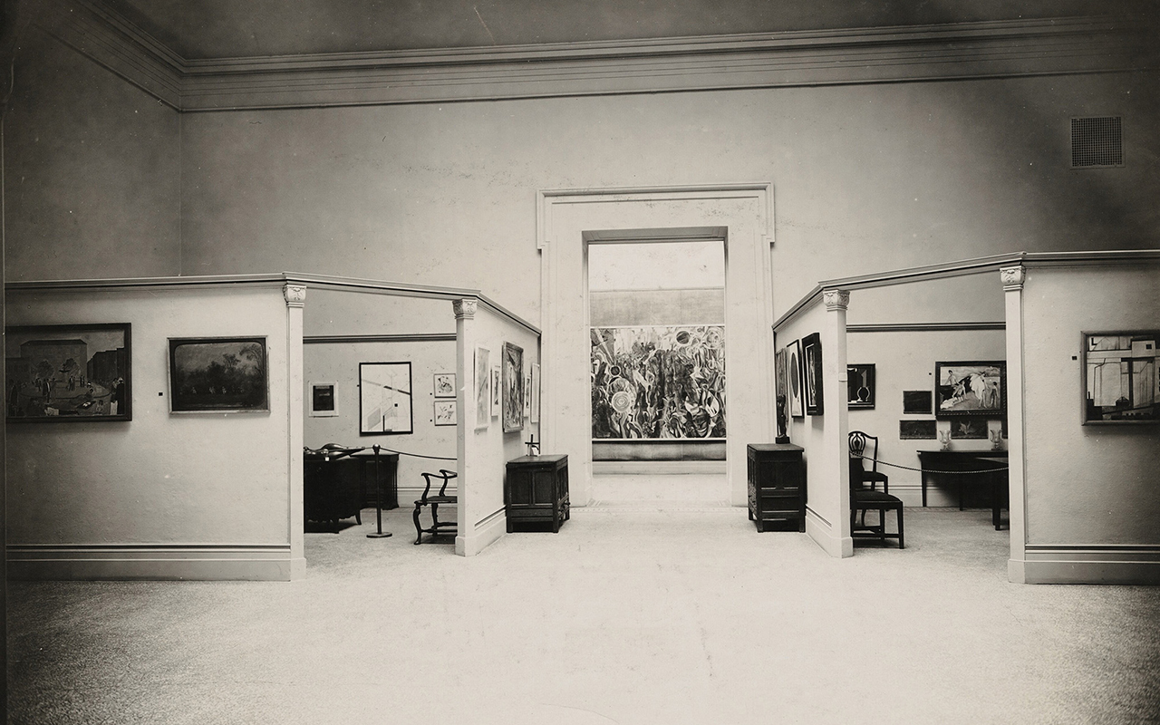 An interior view of two of the four domestic “rooms” at the International Exhibition of Modern Art, Brooklyn Museum.