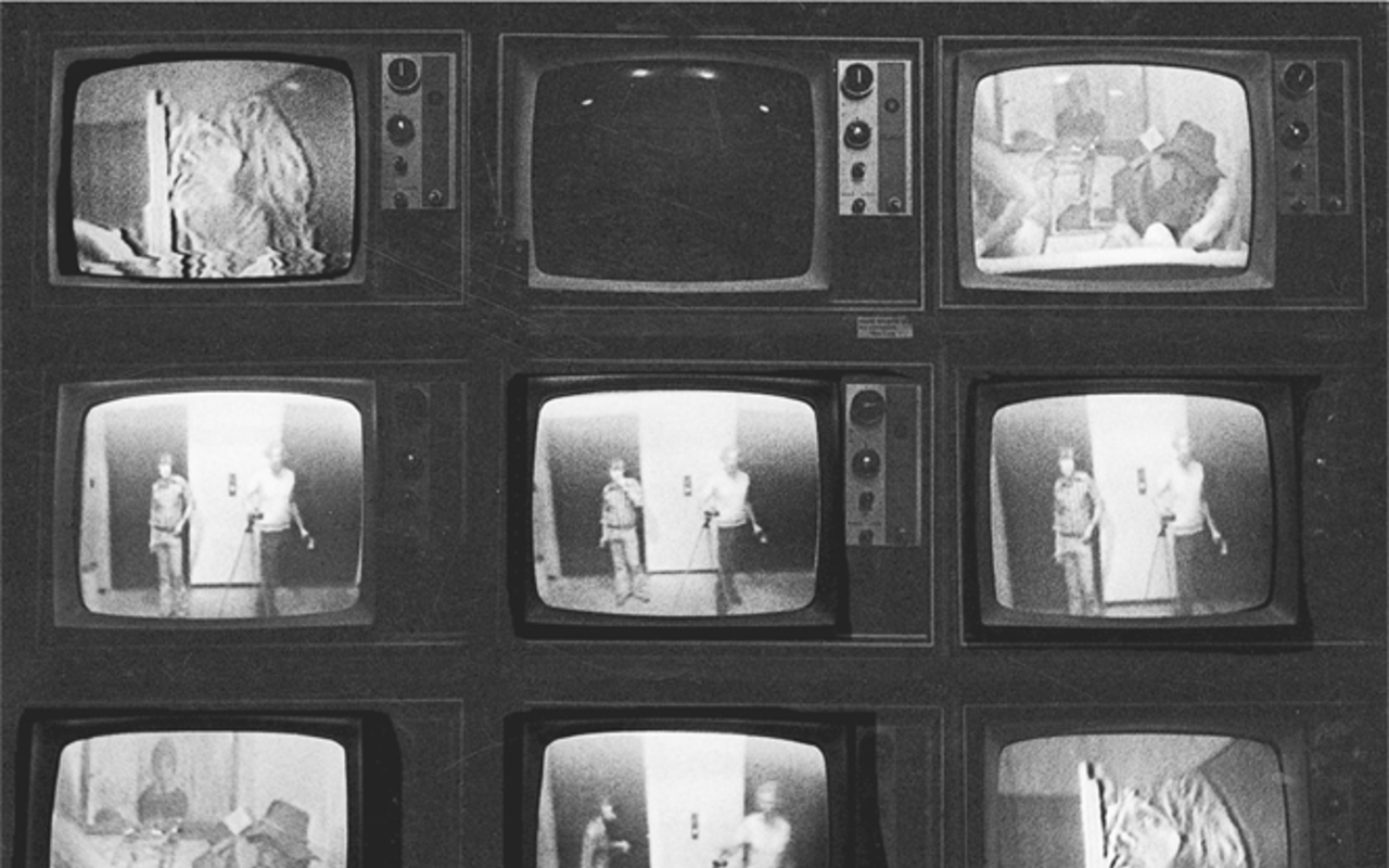 A photograph of 3 rows having 3 ancient televisions in each row. Each has a longitudinal row of adjusting buttons to the right. Except for the second television, everything else has pictures on them.