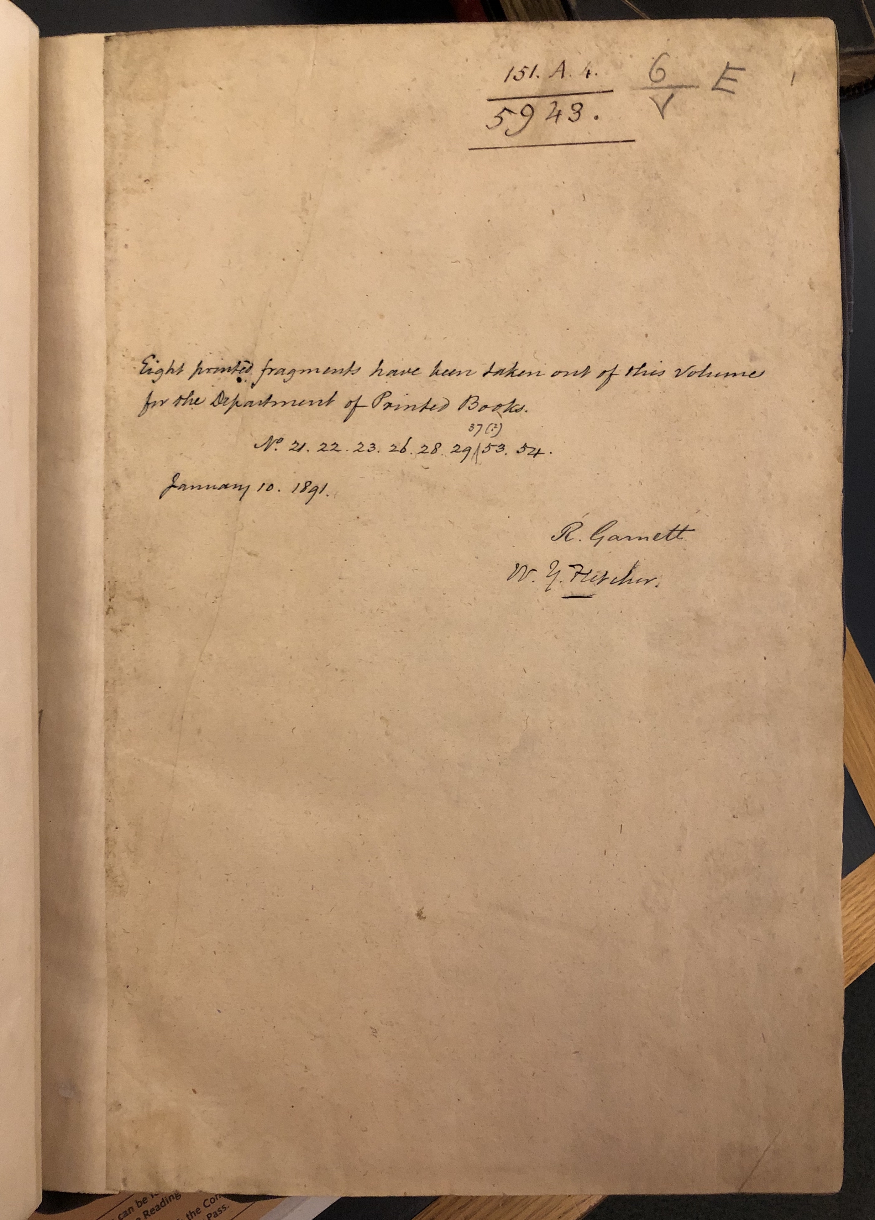 Photograph of the flyleaf in one of John Bagford's assembled albums of scraps showing layered shelfmarks